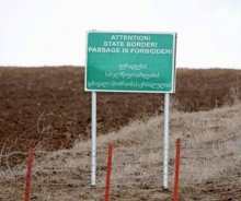 south_ossetia_border_sign_warning_Crop