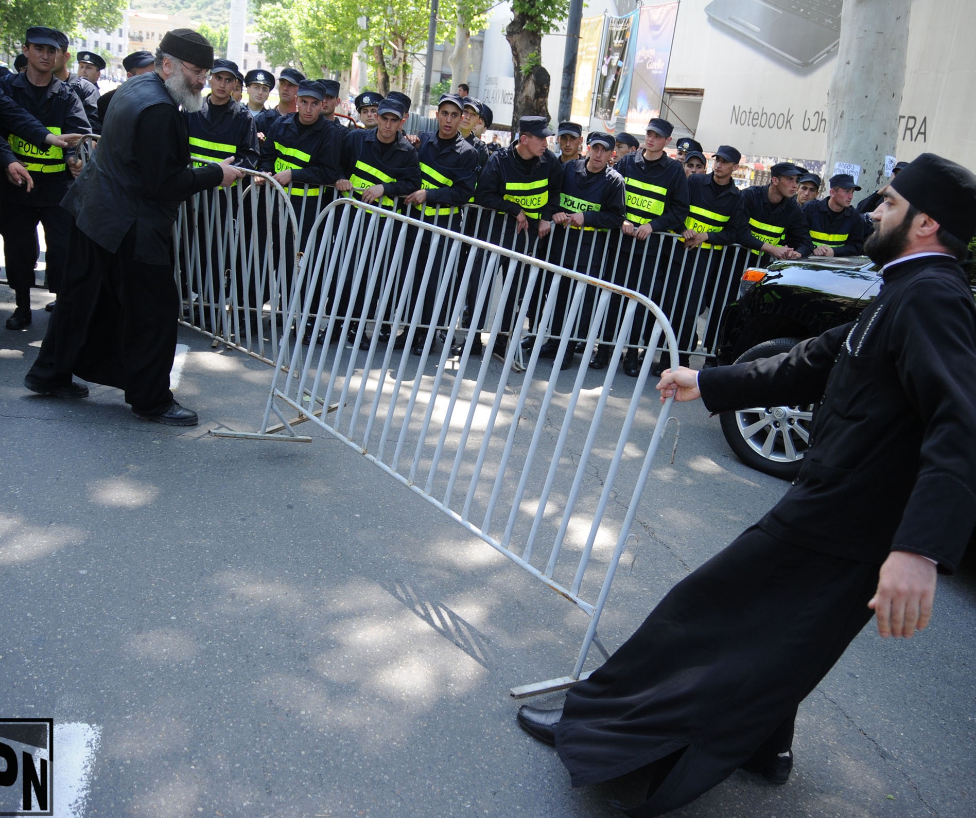 priests removing police cordon 2013-05-17