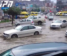 Swimming cars on Hero's Square in Tbilisi following strong rain