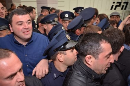 Tbilisi council members were forcibly dragged away before two controversial property plans were approved