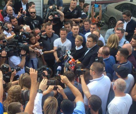 Yulia Timoshenko and Mikheil Saakashvili addressing a large crowd of journalists before boarding a train in Poland bound for Lviv, Ukraine